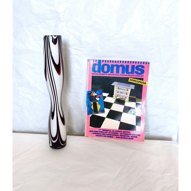 Made in Murano glass in Italy, 1970s. This vase features its original label. It might show slight traces of use since it's...