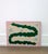 24" x 18" An abstract painting of a two-headed green snake with spots of blue, coral, and lavender on a tan background and...