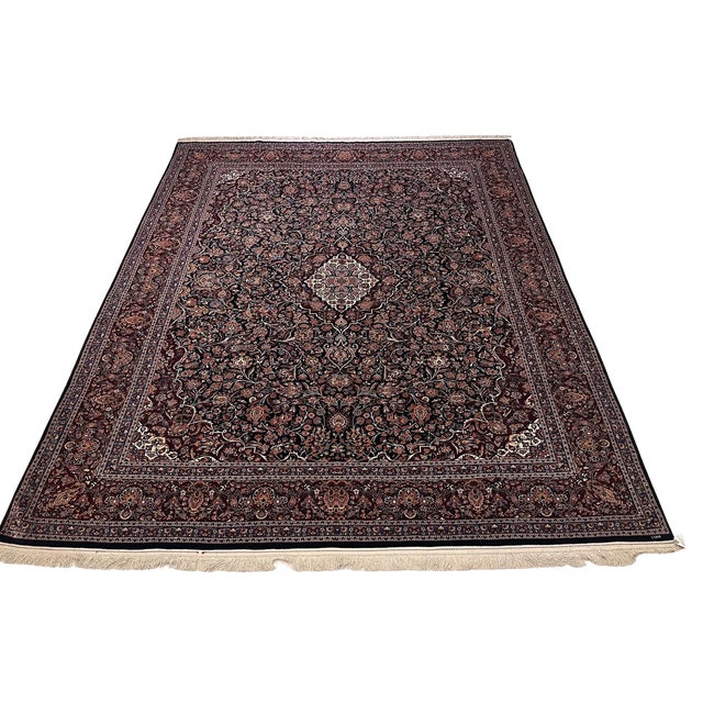 This beautiful vintage Hereke rug, hand knotted in Turkey approximately 40 years ago, features the hallmarks that make...