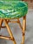A cheerful and classic mid-century bent rattan ottoman that instantly brightens any space with its playful tropical flair....