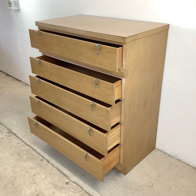 This Mid-Century tall chest of drawers for the Fashion Trend Line by Johnson Carper marks an exceptional piece that brings...