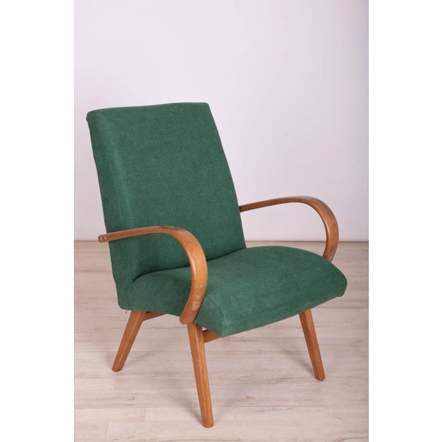 This pair of model 53 armchairs was manufactured by Ton in the 1950s to 1960s. They were designed by Jaroslav Smidek. The...
