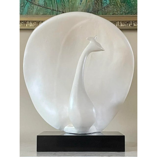 Outstanding large modernist abstract peacock form sculpture in ceramic with a lite satin glazed/painted finish resting on...