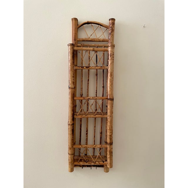 This vintage scorched bamboo wall organizer offers beautiful craftsmanship and practical storage in a compact, vertical...