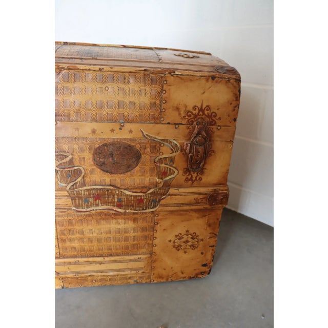 Paint decorated steamer trunk, painted to look like leather.