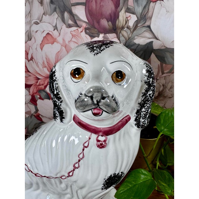 A striking pair of vintage Staffordshire-style spaniel dogs, signed and numbered examples designed by Jay Willfred and...