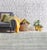 A hand-knotted wool rug, made in India and measuring 5' x 8'. Geometric drawing - repeating motifs held inside strong...