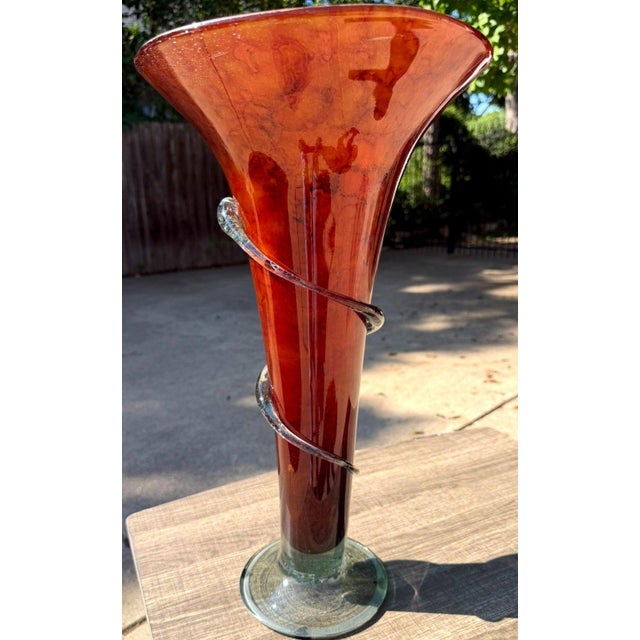 Striking large-scale hand-blown art glass vase featuring a dramatic flared trumpet form in luminous amber, copper and...