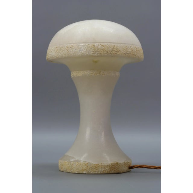 Beautiful Italian Mid-Century Modern period mushroom-shaped ivory coloured alabaster lamp. This adorable atmospheric lamp...