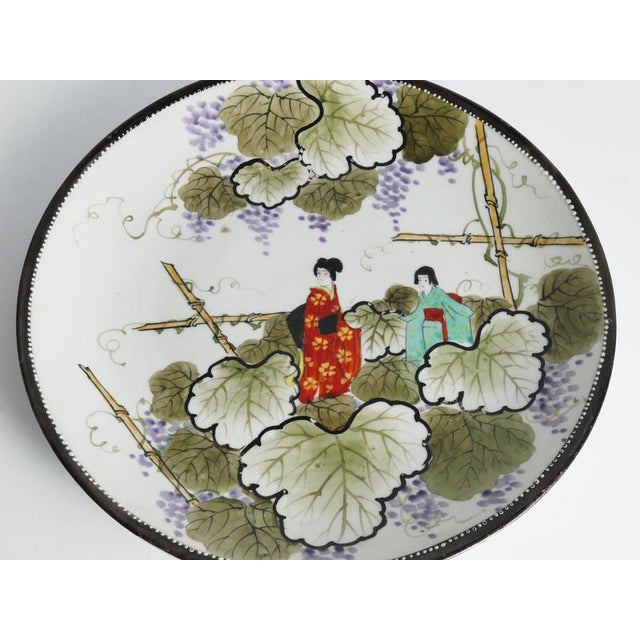 Meiji Hand-Painted Kutani Porcelain Charger with Women and Vine Arbor, 1920s For Sale - Image 10 of 18