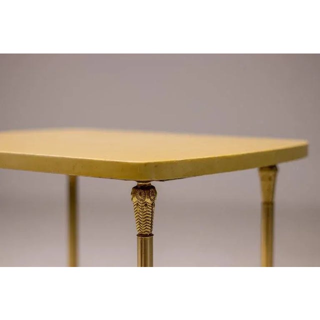 Desirable side table designed by Aldo Tura, Italy, circa 1965. Trademark lacquered goatskin parchment with legs in brass....