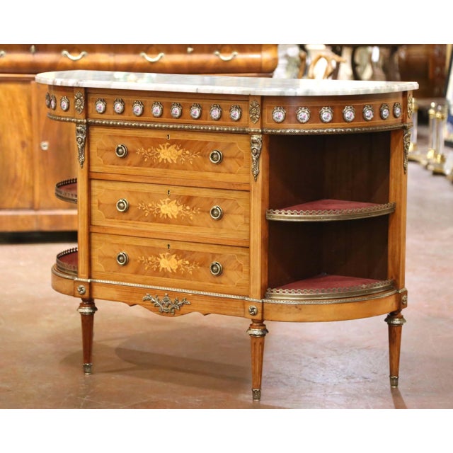 Elegant in form and exceptionally detailed, this antique-style French “commode à l’anglaise” was crafted circa 1940 in the...