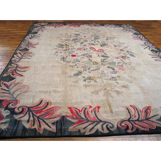 Antique American hooked rug, size: 9'0" x 12'0".
