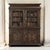 The artistry of 18th century French cabinetmaking is on magnificent display in this Régence period carved oak bookcase. A...