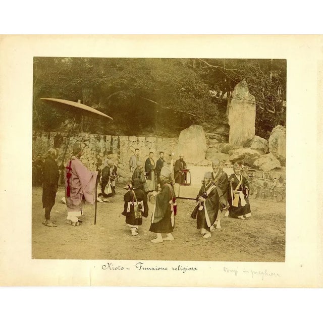 Religious ceremony in Kyoto is an hand-inked Albumen print with aniline applied on hardcover. Very good conditions....