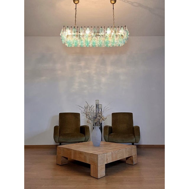 Elegant italian chandelier made from 138 beautiful murano turquoise and transaprent glasses "poliedri". Structure in gold...