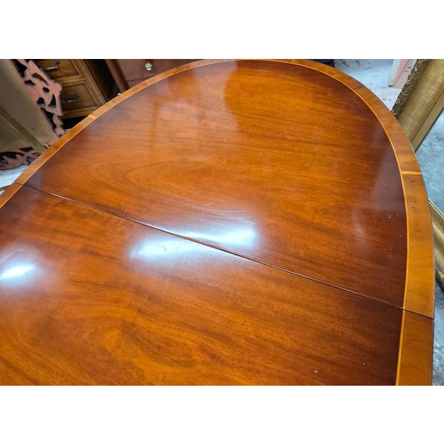 Brown English Regency Revival Flame Mahogany Oval Extension Dining Table With Satinwood Crossbanding and Brass Paw Feet, Circa 1935 For Sale - Image 8 of 9