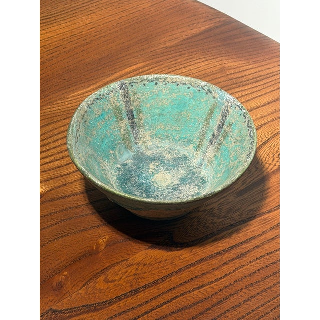 A rare and authentic seljuk-period pottery bowl, dating to the 12th–13th century ad and accompanied by a certificate of...
