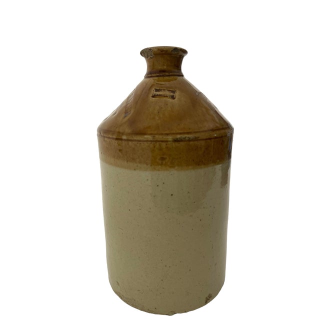 This is a large, antique pottery jug made by Doulton Lambeth for the English wine and spirit merchant William Turner. The...