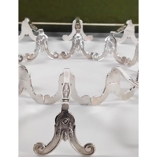12 Christofle Marie Antoinette model Knife Rests. France (1960-1980). These Marie Antoinette knife rests feature motifs...
