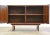 A mid century modern walnut two door credenza cabinet with aluminum pulls designed by Jens Risom. Finished back....