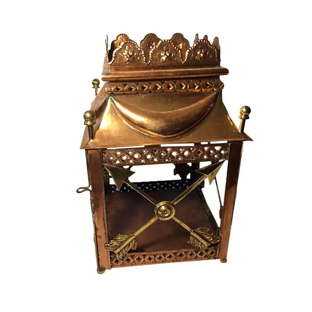 Classic design copper and brass with crossed arrows lantern. No glass, can be easily installed where clips are there. With...