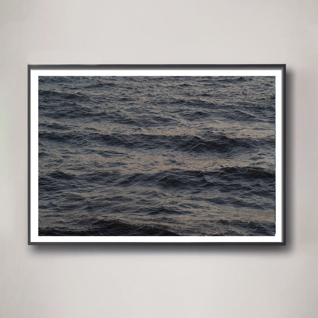 Deep, mysterious, and majestic. This scene of the Pacific Ocean at dusk has muted sunset colors of dark denim with warm...