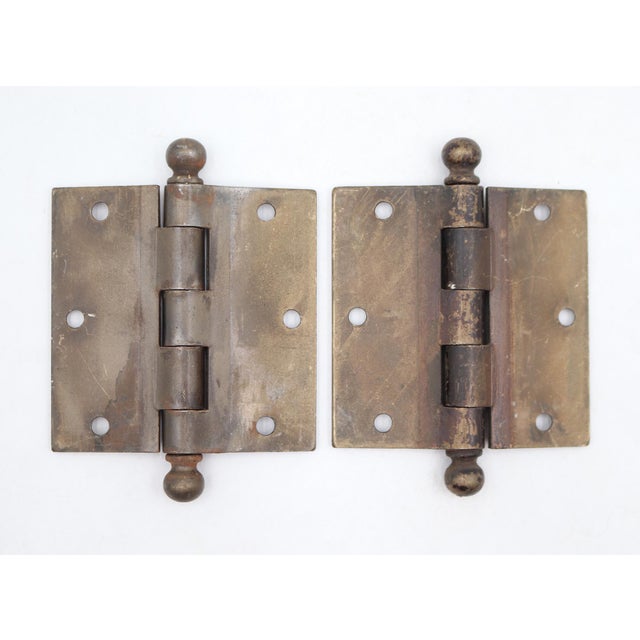 These door hinges are made of steel with ball tips, five knuckles, and a template hole pattern. The original mounting...