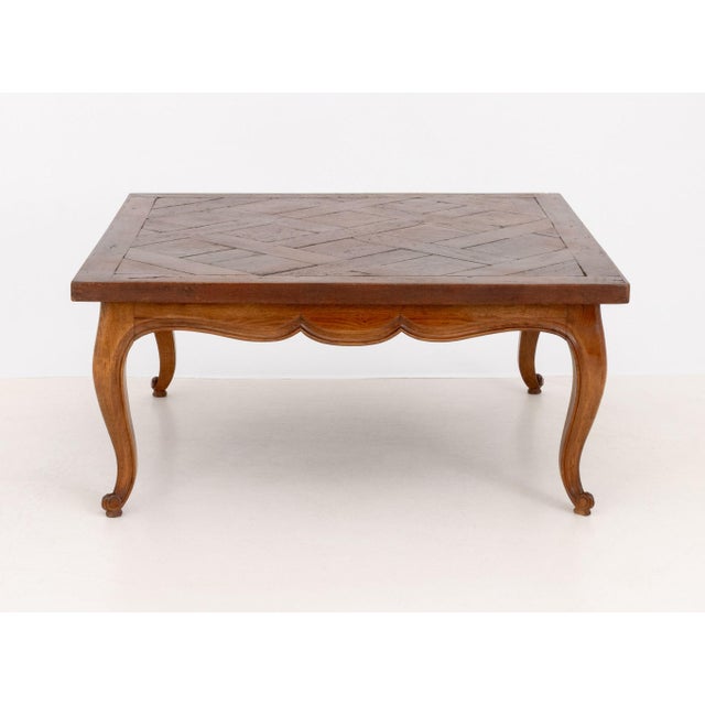 French Provincial Style Parquetry Top Oak Coffee Table, atop cabriole legs. 18" H x 39.25" W x 39.25" D. Provenance: From...