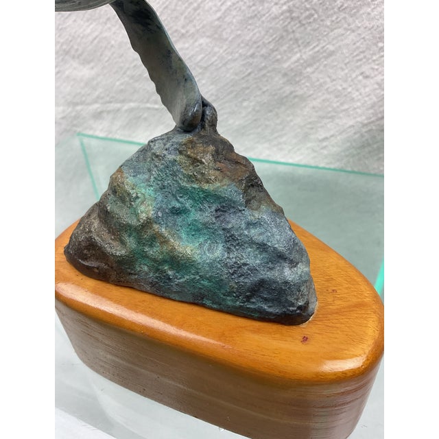 Beautiful sculpture of Mama and baby Humpback Whales swimming. Very well done,mounted on wood base.
