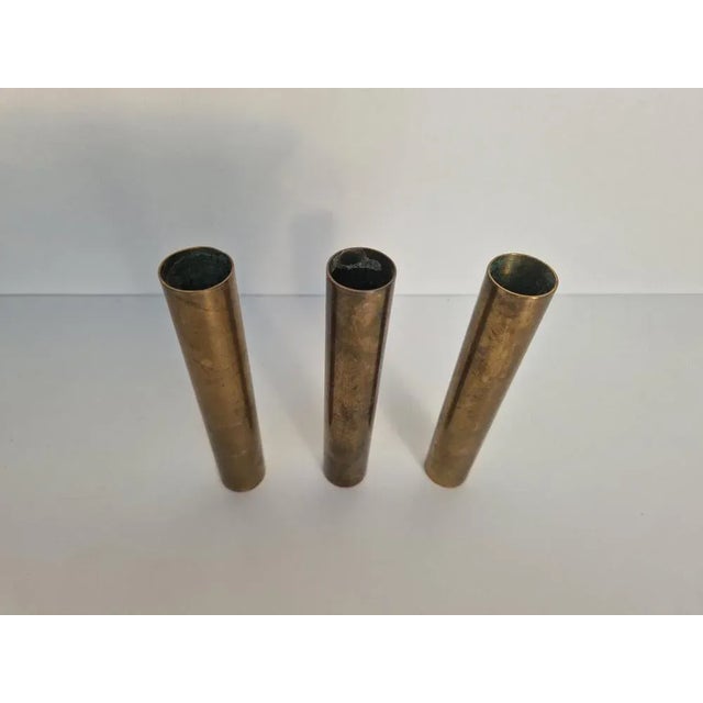 Factual candle holder from Nicolai Monies, heavy brass. This piece has an attribution mark, I am sure that it is...