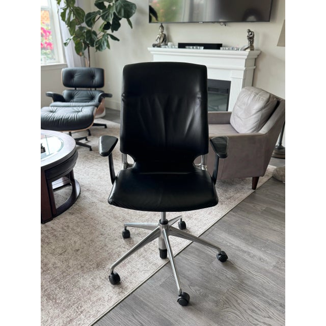 Vitra swivel leather chair designed by Alberto meda with polished aluminum base, leather seat and back. Height and recline...