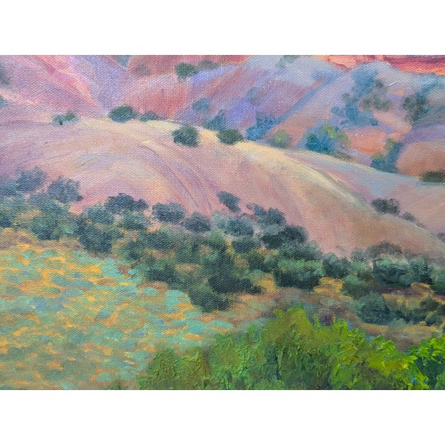 Soft red and orange toned naturalistic landscape painting by Houston based artist Nancy Paris Pruden. The work features a...