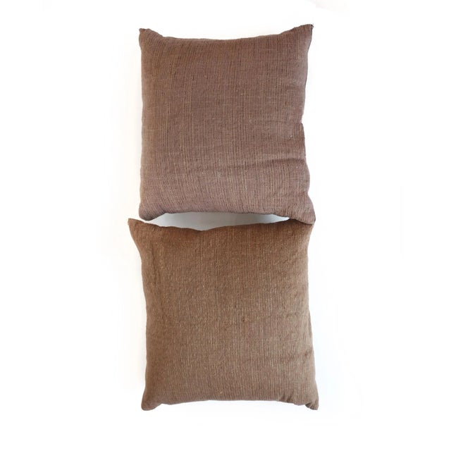 A lovely pair of silk and cotton throw pillows by Avec Arcade and made in Italy. While both are variations of brown, one's...