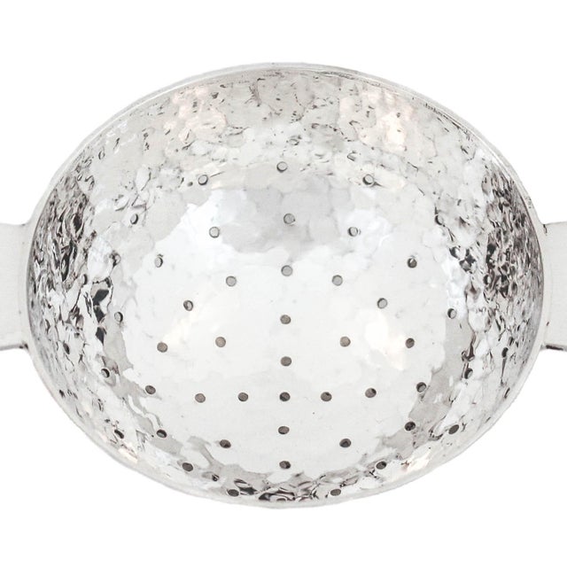 Being offered is a sterling silver tea strainer in the American Craftsman (aka Craftsman) style. This piece is hand-...