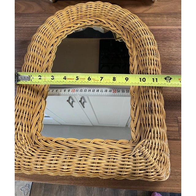 Add warmth and natural elegance to your home with this **Vintage Mid-Century Modern (MCM) Wicker Wall Mirror**....