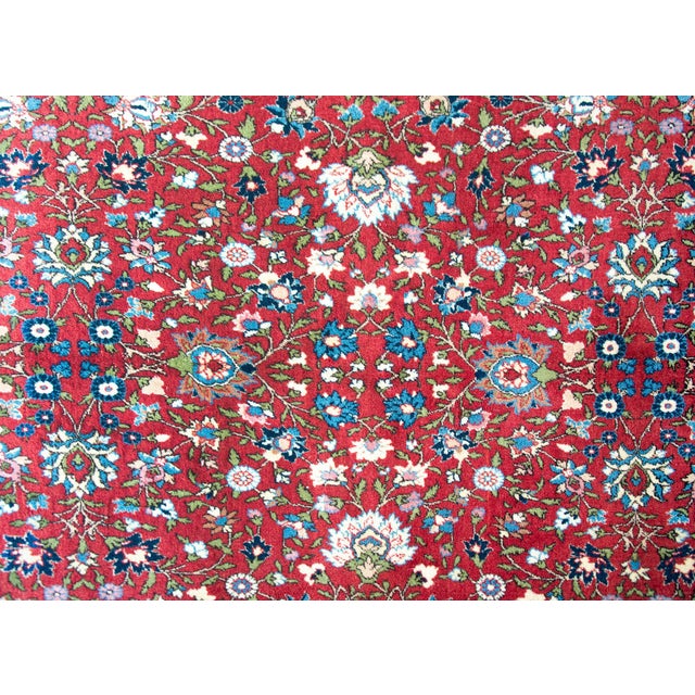 A wonderful mid-20th century Persian Varamin rug with an all-over mirrored trellis floral pattern with large-scale flowers...