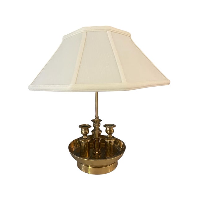 Solid brass bouillotte lamp with 2 light sockets and 3 candle holders surrounded by a beaded edge. Very elegant. Circa...
