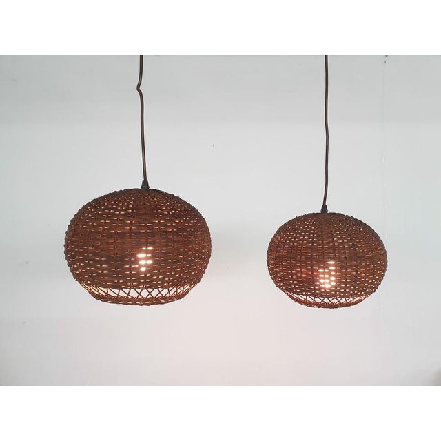 About this item Brown rattan globe pendant lights. Both in good working condition. Up to 250V (Europe/UK Standard).The...