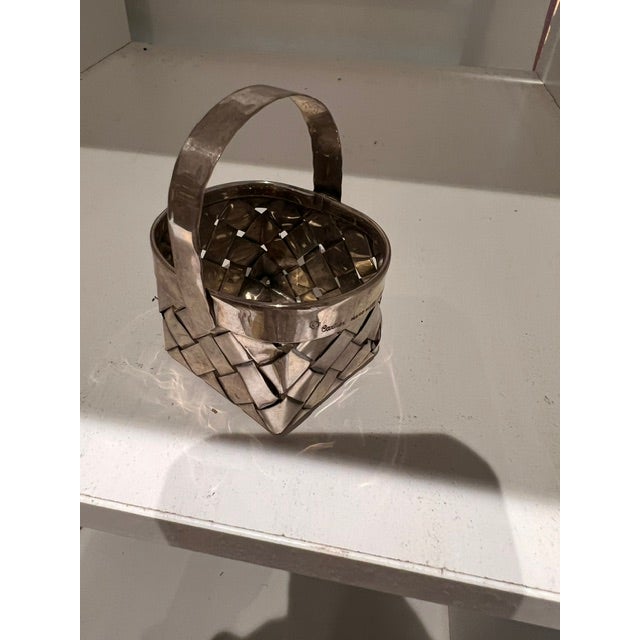 Iconic Cartier mini woven basket. The intricate basket-weave gives it wonderful texture while the warm patina of the...