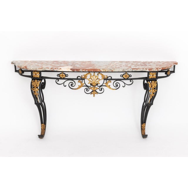 Louis XV Style Marble Top Gilt and Ebonized Iron Console Table. 37.5" H x 81.25" W x 18.75" D. Provenance: From an Upper...