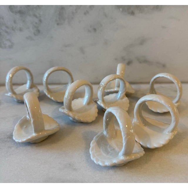 Set of 9 vintage white ceramic napkin rings in the shape of a basket. Perfect addition to your Easter holiday table.