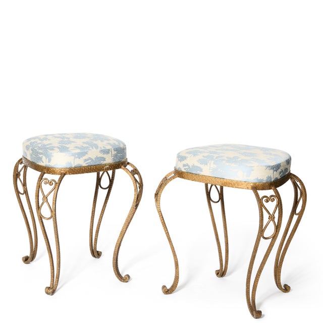 Beautiful upholstered pair of brass stools made in the 1940s in the style of Pier Colli of Turin. Upholstered in Dedar...
