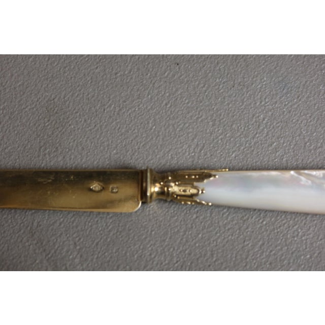 A beautiful set of twelve fruit or cheese knives from the Cardeilhac company. The blades are vermeil (gilt silver),...