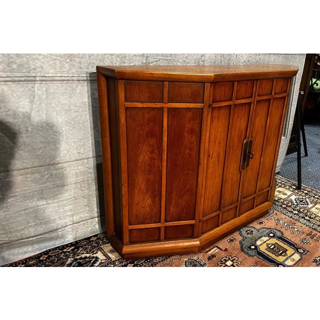 This exceptionally rare and exquisite Mid-Century Modern (MCM) hall chest features a 3-sided top that gracefully sits atop...