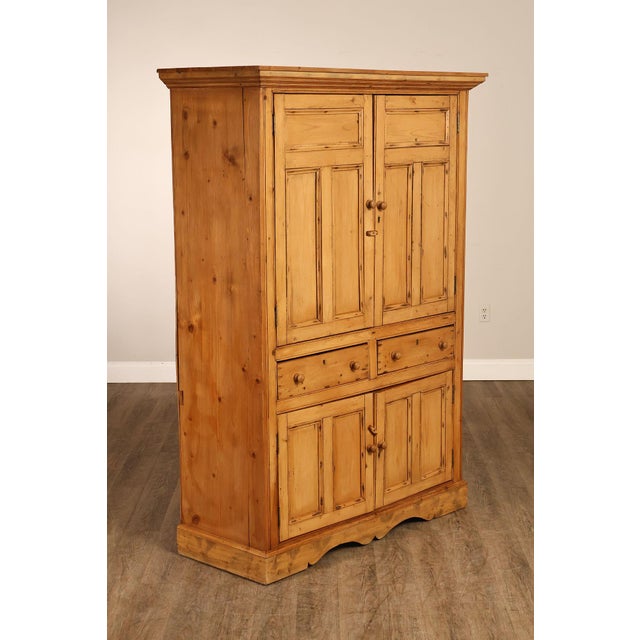 High Quality English Made Pine Armoire Cabinet Featuring Paneled Double Doors Over Central Drawers And Lower Storage...