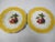 Set of 8 vintage hand painted plates with centers of four different fruit designs. They have a scalloped edge and a yellow...