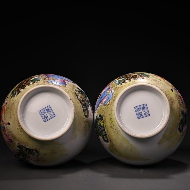 matching pair of elegant Chinese porcelain Yuhuchunping (pear-shaped) vases, hand-decorated in vibrant famille rose...