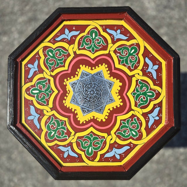 Infuse your home with the rich colors and artistry of Morocco with this stunning handcrafted and hand-painted accent...