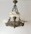 An exceptionally charismatic Renaissance Revival chandelier, circa 1900, combining substantial cast bronze with three...